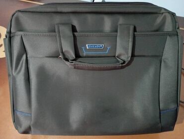 7 объявлений | lalafo.kg: Новая сумка для ноутбука, имеется 2 отделения и 3 внешних кармана на