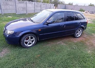 каракол мото: Mazda 323: 2003 г., 1.3 л, Механика, Бензин — 3