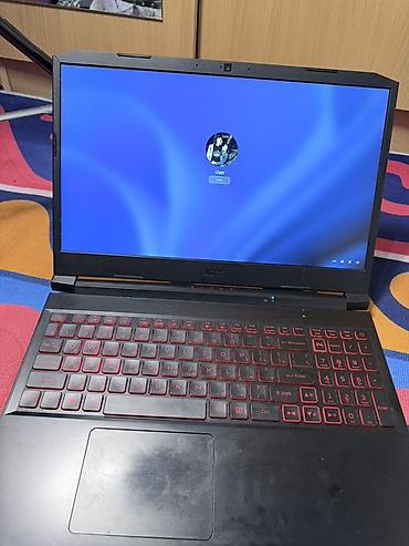 Ноутбуки Acer: Игровой ноутбук Acer в черном корпусе с красной подсветкой клавиатуры — 1