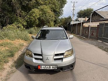 byd e2 2024: Mitsubishi Outlander: 2003 г., 2.4 л, Автомат, Бензин, Кроссовер — 1