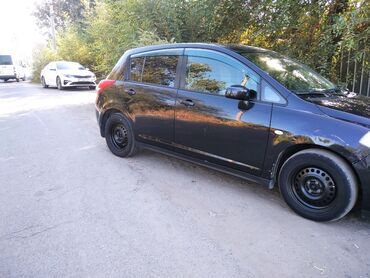 фары нексия 1: Nissan Tiida хэтчбек, черный цвет кузова. Основные особенности: -