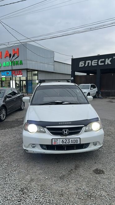 эва полик хонда одиссей: Белый минивэн Honda Odyssey с затемненными окнами и рейлингами на