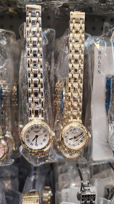 saat sensor: Tissot qadın qol saatları - Klassik dairəvi korpus, Roman rəqəmləri — 5