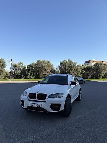 BMW: BMW X6 – ağ rəngli, kupe-siluetli premium krossover. Güclü və dinamik — 3