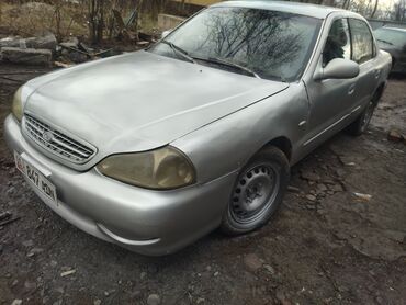 Транспорт: Kia K5: 1999 г., 2 л, Механика, Бензин, Седан