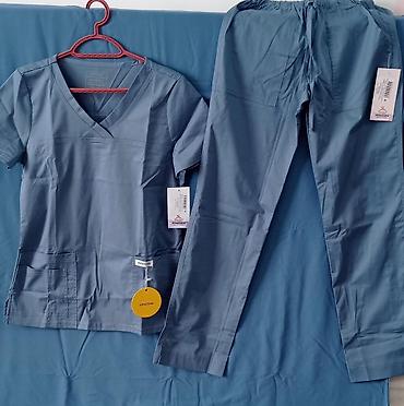 Медицинская одежда: Медицинский халаты,брюки,кофты Варианты моделей: - Приталенный халат — 10