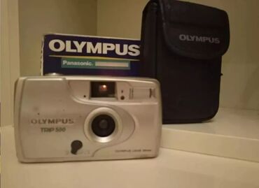 fotoaparat kirayesi: Olympus retro fotoaparat işləyir, kosmetik təmirə ehtiyacı var