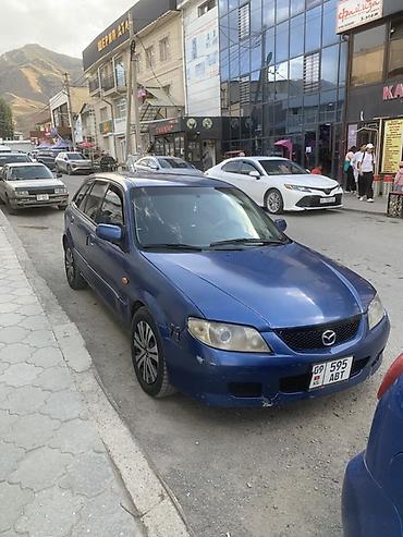 авто пульт: Mazda 323: 2002 г., 1.6 л, Механика, Бензин, Хэтчбэк — 2