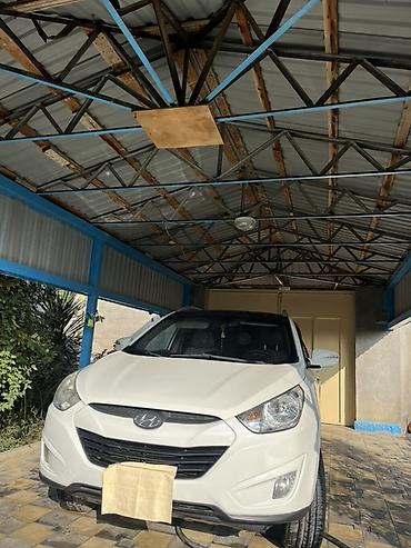 premier hazard siren: Hyundai ix35 – ağ rəngli, şəhər və uzun məsafələr üçün rahat — 3