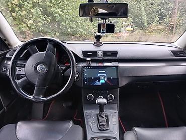 015 maşını: Volkswagen Passat sedan. Avtomobilin salonu qara rəngdədir və ön — 1