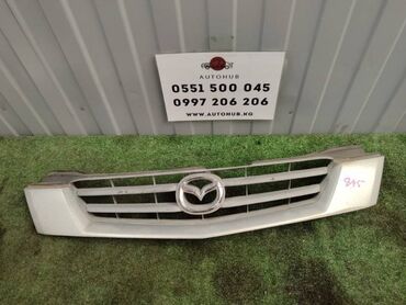 Передние фары: Решетка радиатора Mazda at lalafo.kg Передние фары: Решетка радиатора Mazda