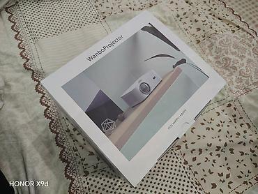 держатель наушников: Проектор Wanbo Projector (модель WB-TXL) - Компактный проектор с — 4