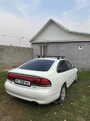 пинин ио: Mazda Cronos: 1994 г., Механика, Бензин, Седан — 3