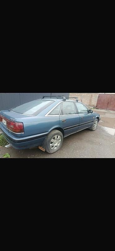 Oldsmobile: Mazda 626: 1988 г., Седан — 6