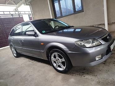 Mazda: Mazda Familia: 2003 г., Бензин, Универсал — 1