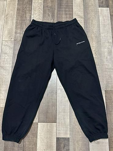 Qara rəngli unisex idman şalvarı - Model: jogger tipli, yığma balaq -