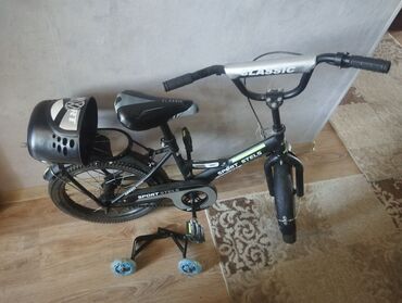 Uşaq velosipedləri: Sport Stels brendinə məxsus uşaq velosipedi. Qara rəngli velosipeddə