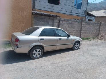 купить аварийный мотоцикл: Легковой автомобиль седан в бежевом цвете, представленный сбоку. Кузов