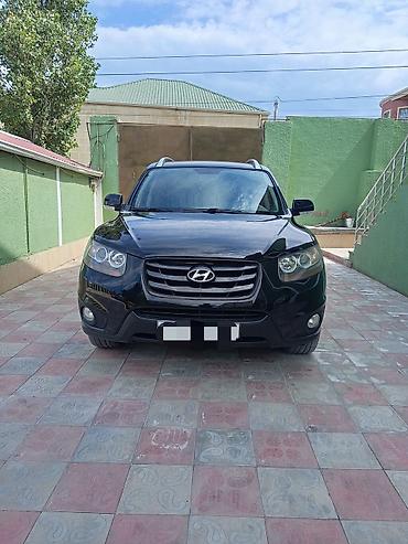 opel duman: Hyundai Santa Fe: 2 l | 2010 il Krossover — 1