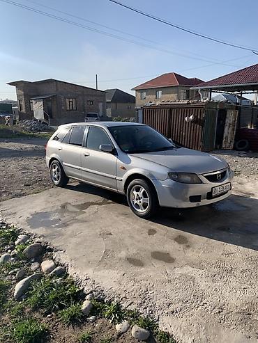 стекло на одиссей: Mazda 323: 2003 г., Механика, Бензин, Универсал — 3