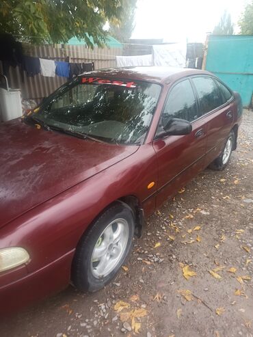 авто до 300000 сом: Mazda Cronos: 1994 г., 1.8 л, Механика, Бензин, Хэтчбэк