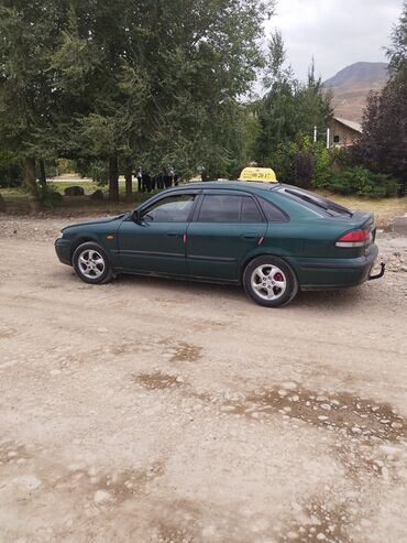 купить шины для погрузчика: Mazda 626: 1998 г., 2 л, Механика, Бензин, Хэтчбэк
