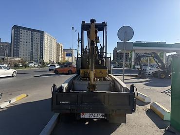 услуги экскаваторов: Услуги мини‑экскаватора CAT - Гусеничный мини‑экскаватор Caterpillar — 3