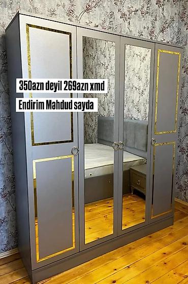 Ev üçün mebel: Dördkapılı şkaf – boz rəng, qızılı dekor xətləri ilə. - Orta hissədə — 1