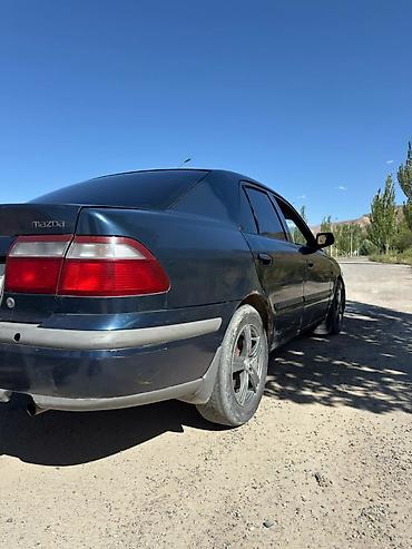 385 55: Mazda 626: 1997 г., 1.8 л, Механика, Газ, Седан — 7