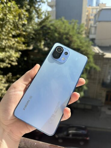 mi̇ 10 t: Xiaomi Mi 11 Lite, 128 ГБ, цвет - Голубой, 
 Отпечаток пальца, Кнопочный, Face ID