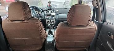кажы сай: Mazda 323: 2001 г., 1.6 л, Кол менен иштөөчү, Бензин, Универсал — 5