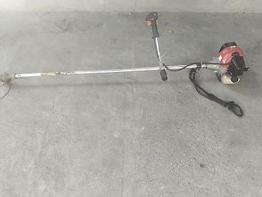 benzinli ot bicən: Benzinli otbiçən (trimmer) - Yanmalı mühərriklə işləyən, çiyinə asma — 3