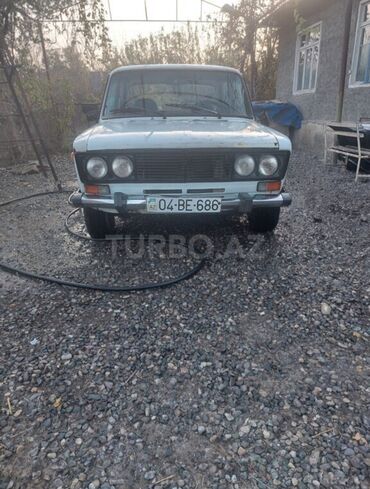 авто запчасти ваз 2110: Ağ rəngli, dördqapılı sedan kuzalı minik avtomobili. Avtomobilin ön