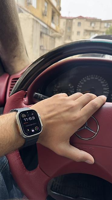 timex saat: Apple Watch Ultra (49 mm) – titan korpus və Ocean Band tipli qara — 1