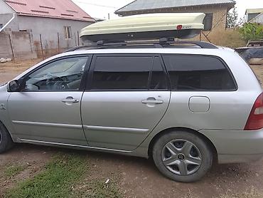 на corolla: Toyota Corolla: 2004 г., Механика, Универсал — 4