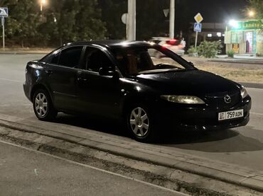 ключ мазда: Черный седан Mazda 6. Автомобиль оснащен четырьмя дверями, люком в