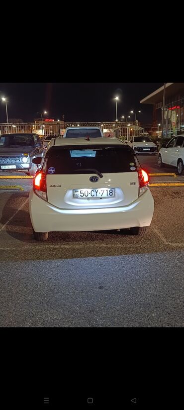 фольксваген пассат 1 8 турбо: Toyota Aqua (hybrid) – ağ rəng, 5 qapılı hatchback.Avtomobil 1.5 mator