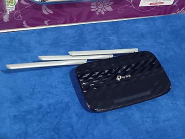 Модемы и сетевое оборудование: Wi‑Fi роутер TP‑Link (серия Archer/серый низ, глянцевая чёрная крышка — 9