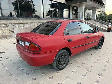 Унаа: Mazda Familia: 1996 г., 1.8 л, Автомат, Бензин, Седан — 5