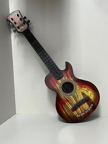 ukulele gitar: Uşaq üçün oyuncaq gitara - Model: “Guitar” yazılı başlıq, korpusda — 2