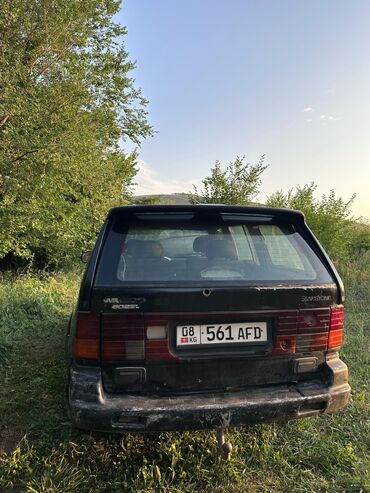 набор ключей в чемодане цена: Внедорожник SsangYong Musso черного цвета. Автомобиль оснащен