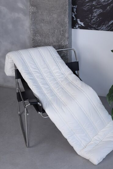 шерстяное одеяло: Это полностью органическое шерстяное одеяло помогает регулировать