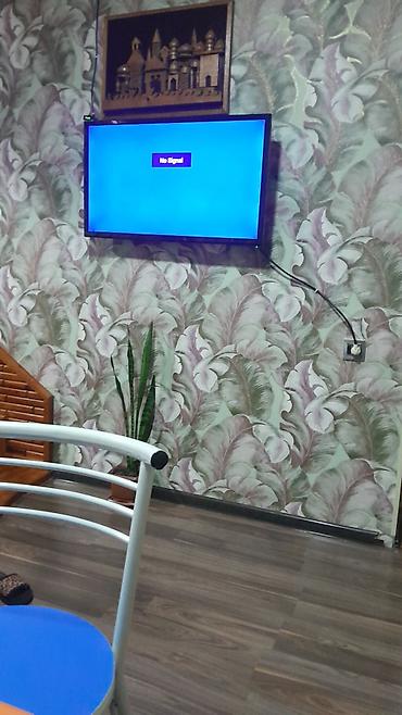 cekc tv: LED televizor, təxminən 32–40 düym diaqonallı, nazik çərçivəli model — 1