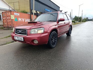 авто лизинг рассрочка: Кроссовер Subaru Forester в красном цвете с обвесом. Оснащен черными