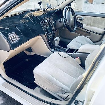 diska 13: Nissan Sunny: 2002 г., Автомат, Бензин, Седан — 4