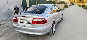 чехол на мопед: Mazda 626: 2000 г., 2 л, Механика, Бензин, Хэтчбэк — 8