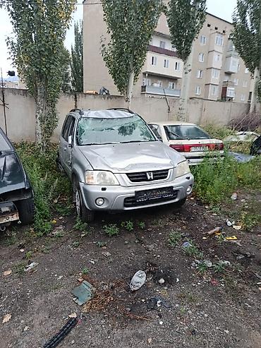Унаа: Honda CR‑V I (рестайлинг), серебристый кроссовер 5‑дв. По кузову — 2