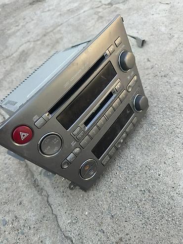 3 3: Штатная магнитола Subaru с блоком климат‑контроля Описание: - — 3
