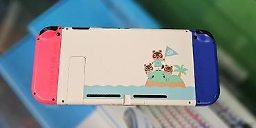 Nintendo Switch: Игровая консоль Nintendo Switch с разноцветными Joy‑Con (левый — — 2