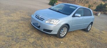 продажа авто в азербайджане: Mavi rəngli, 5 qapılı Toyota Corolla hetçbek avtomobili. Avtomobilin